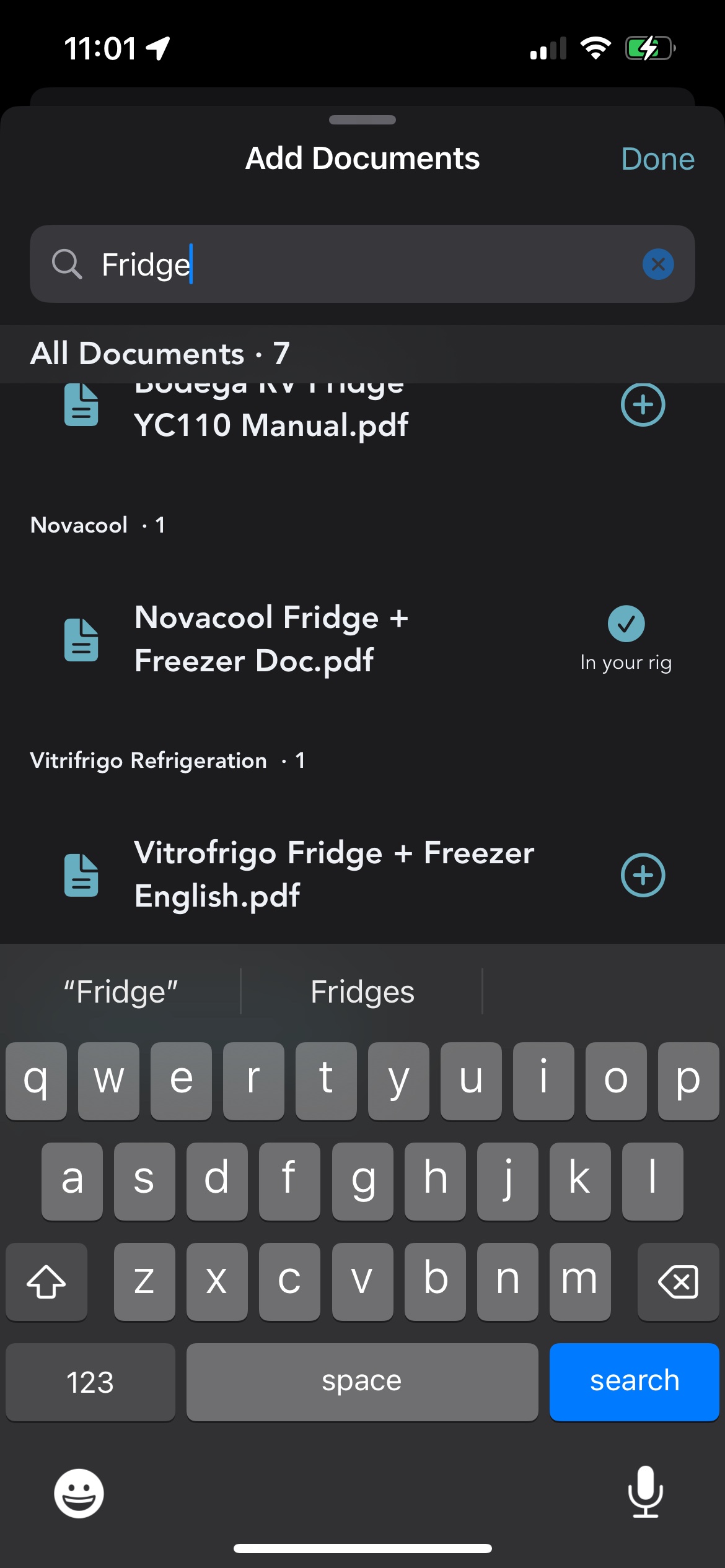The Grover Glovebox Add Documents search sheet with the query Fridge entered, showing All Documents results grouped by brand, including a Novacool fridge and freezer manual already in the rig and a Vitrifrigo fridge and freezer manual with a plus button to add it