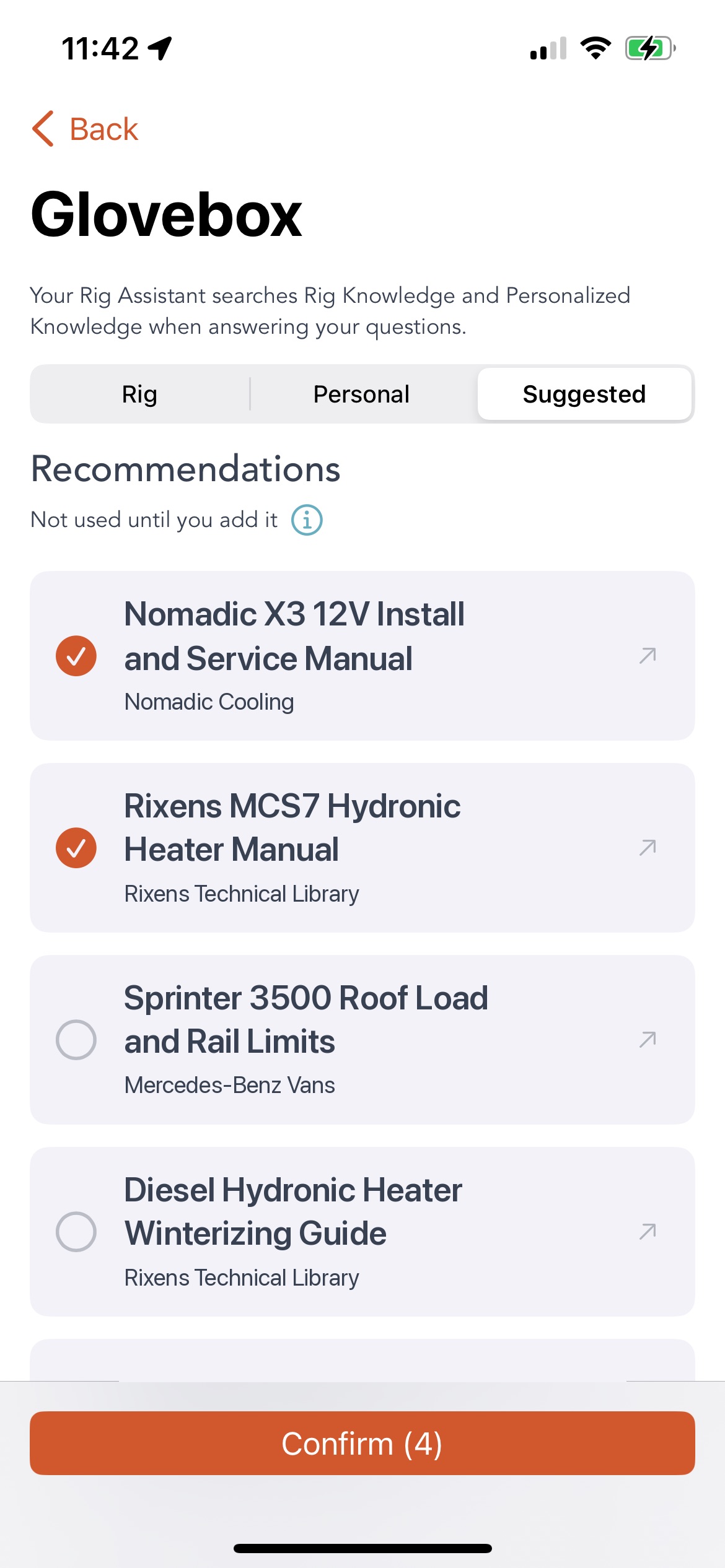 The Grover Glovebox screen with the switcher set to Suggested, a Recommendations heading with the subtitle Not used until you add it, and four suggested documents: Nomadic X3 12V Install and Service Manual from Nomadic Cooling and Rixens MCS7 Hydronic Heater Manual from Rixens Technical Library both checkmark-selected in orange, then Sprinter 3500 Roof Load and Rail Limits from Mercedes-Benz Vans and Diesel Hydronic Heater Winterizing Guide from Rixens Technical Library left unselected, above an orange Confirm button reading Confirm with four in brackets